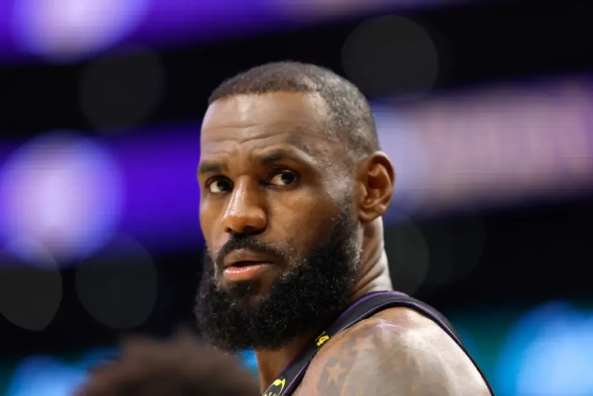 NBA All-Star Lebron James reunites with a woman in Oregon that he bumped into during a game in 2019. (Photo by Ronald Martinez/Getty Images)