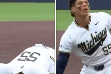 Mitch Voit del Michigan sembra fingere di sbuffare la linea di cocaina dopo la tripla RBI