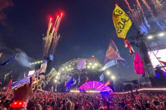 GLASTONBURY, ENGLAND - JUNE 29: Fireworks explode as Coldplay perform on the Pyramid stage during day four of Glastonbury Festival 2024 at Worthy Farm, Pilton on June 29, 2024 in Glastonbury, England. Founded by Michael Eavis in 1970, Glastonbury Festival features around 3,000 performances across over 80 stages. Renowned for its vibrant atmosphere and iconic Pyramid Stage, the festival offers a diverse lineup of music and arts, embodying a spirit of community, creativity, and environmental consciousness. (Photo by Jim Dyson/Redferns)