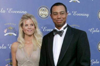 DETROIT - SEPTEMBER 15:  USA team member Tiger Woods with his fiance Elin Nordegren arriving at the 35th Ryder Cup Matches Gala Dinner at the Fox Theater on September 15, 2004 in Detroit, Michigan. (Photo by Andrew Redington/Getty Images)