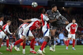 LONDON, ENGLAND - APRIL 08: Jude Bellingham of Real Madrid shoots at goal whilst under pressure from Thomas Partey of Arsenal during the UEFA Champions League 2024/25 Quarter Final First Leg match between Arsenal FC and Real Madrid C.F. at Emirates Stadium on April 08, 2025 in London, England. (Photo by Justin Setterfield/Getty Images)