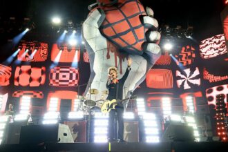 INDIO, CALIFORNIA - APRIL 19: (FOR EDITORIAL USE ONLY) (L-R) Tré Cool, Billie Joe Armstrong and Mike Dirnt of Green Day perform at the Coachella Stage during the 2025 Coachella Valley Music and Arts Festival on April 19, 2025 in Indio, California. (Photo by Kevin Mazur/Getty Images for Coachella)