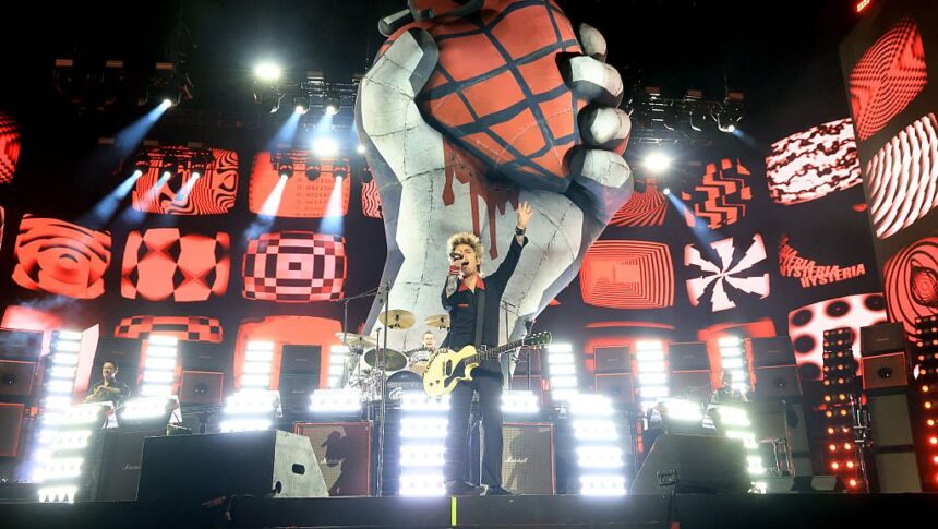 INDIO, CALIFORNIA - APRIL 19: (FOR EDITORIAL USE ONLY) (L-R) Tré Cool, Billie Joe Armstrong and Mike Dirnt of Green Day perform at the Coachella Stage during the 2025 Coachella Valley Music and Arts Festival on April 19, 2025 in Indio, California. (Photo by Kevin Mazur/Getty Images for Coachella)