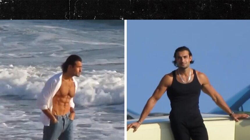 Sam Asghari mostra gli addominali duri in roccia in un servizio fotografico in spiaggia con vapore di Malibu