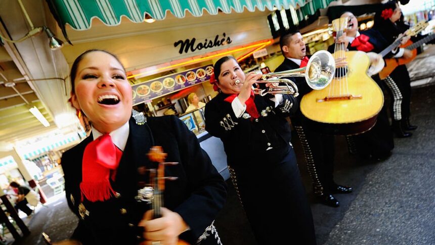 LOS ANGELES, CA - MAY 05:  Judith Merillo (L) Esmeralda Garcia (2nd-L) Guillermo Nunez (C) Mariana Nanez and Ileana Garcia (R)  members of the all-female strolling Mariachi band, Ellas Son, perform at Los Angeles Farmer Market during Cinco de Mayo festivities on May 5, 2011 in Los Angeles, California. Nunez was filling for the recovering injured female base player who was shot in the arm at a Mexican restaurant two weeks ago. Cinco de Mayo celebrates the 1862 Mexican victory over the French in the Battle of Puebla.  (Photo by Kevork Djansezian/Getty Images)
