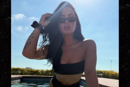 Demi Lovato sfrigola in nuove foto di bikini neri, si immerge in piscina