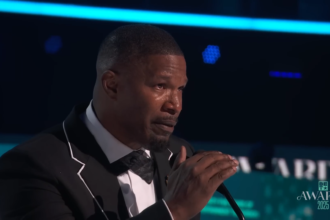 Jamie Foxx speaks on stage at the 2025 BET Awards.