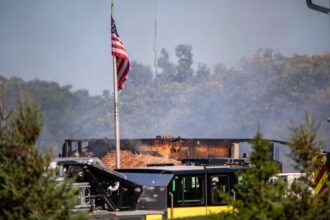 Emergency services respond to a shooting and fire at the Church of Jesus Christ of Latter-day Saints on September 28, 2025 in Grand Blanc, Michigan.