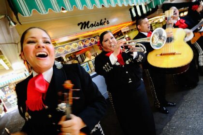 LOS ANGELES, CA - MAY 05:  Judith Merillo (L) Esmeralda Garcia (2nd-L) Guillermo Nunez (C) Mariana Nanez and Ileana Garcia (R)  members of the all-female strolling Mariachi band, Ellas Son, perform at Los Angeles Farmer Market during Cinco de Mayo festivities on May 5, 2011 in Los Angeles, California. Nunez was filling for the recovering injured female base player who was shot in the arm at a Mexican restaurant two weeks ago. Cinco de Mayo celebrates the 1862 Mexican victory over the French in the Battle of Puebla.  (Photo by Kevork Djansezian/Getty Images)